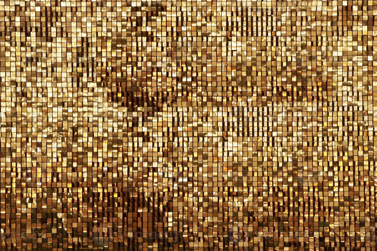 Golden rainbow background from small squares. Iridescent golden glass texture background. Multicolored icy shiny crystal texture. Abstract iridescent texture. photo