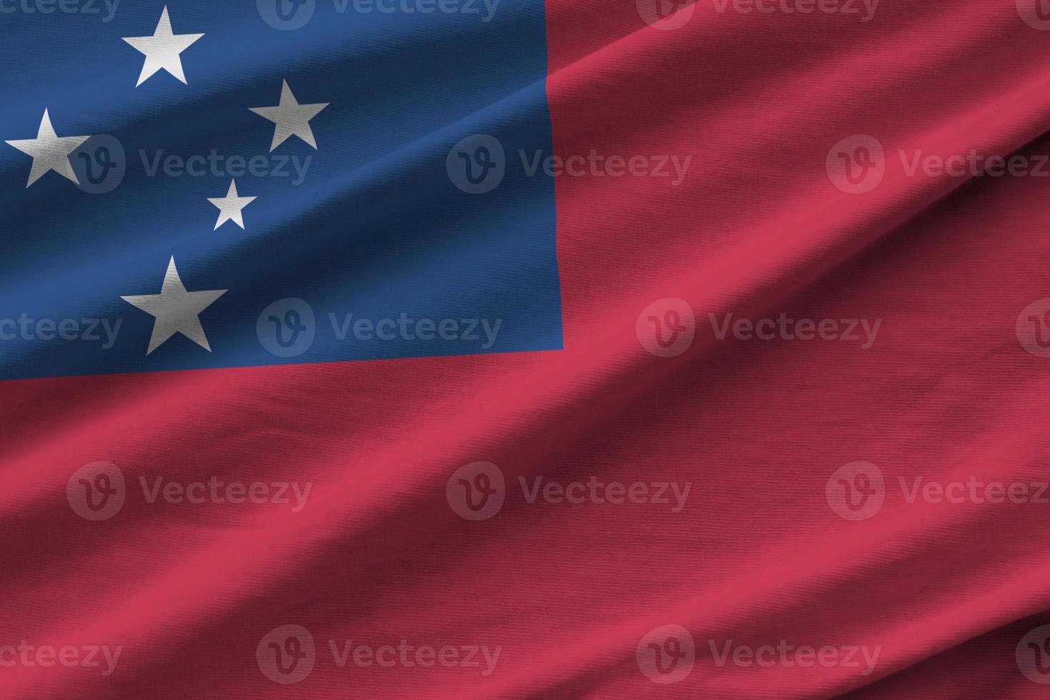 Samoa flag with big folds waving close up under the studio light indoors. The official symbols and colors in banner photo