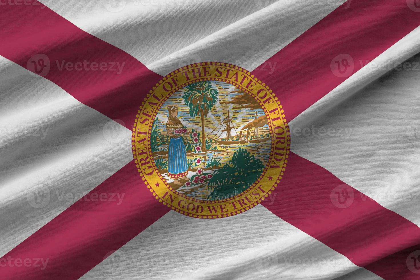Florida US state flag with big folds waving close up under the studio light indoors. The official symbols and colors in banner photo