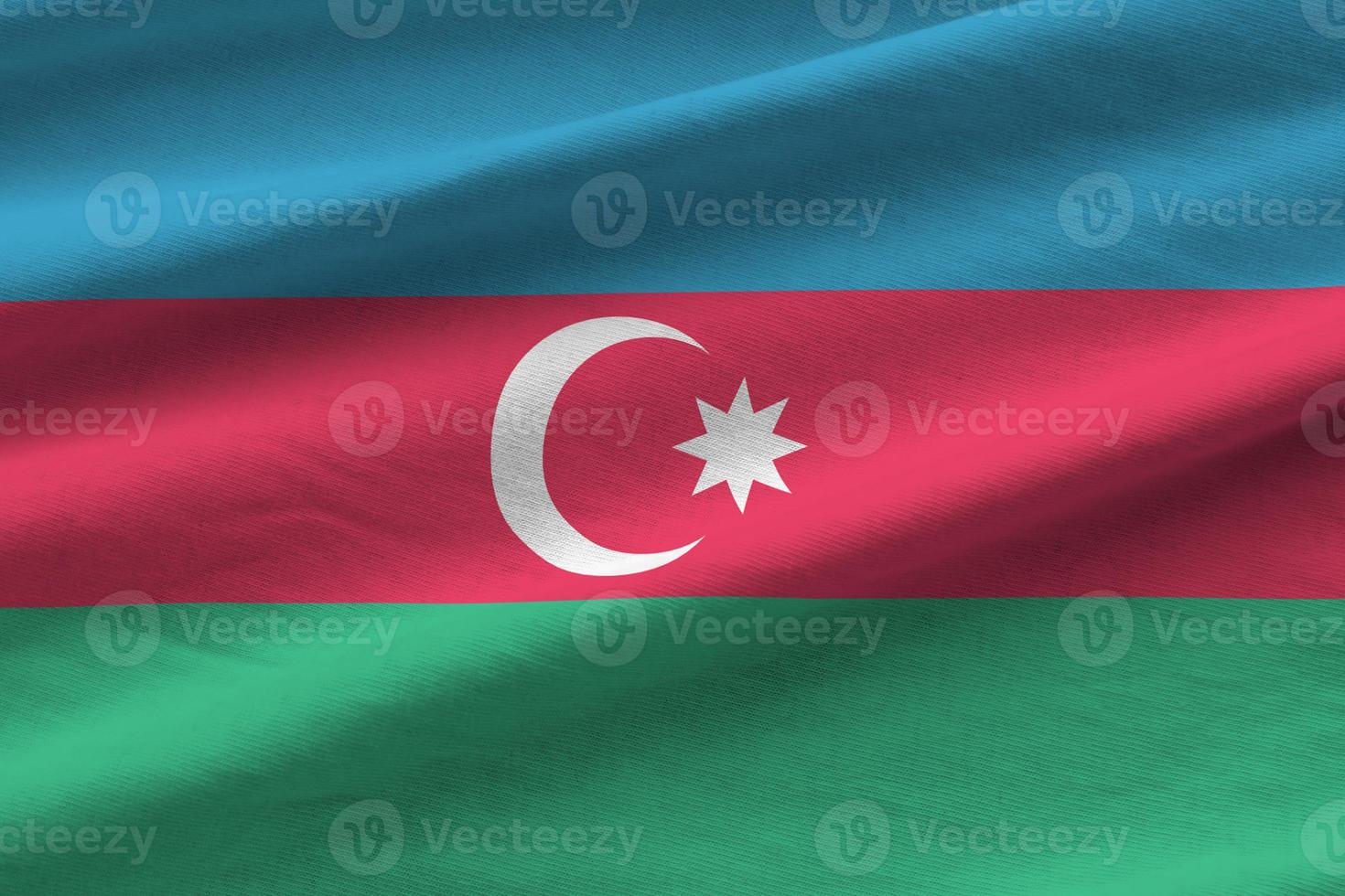 Azerbaijan flag with big folds waving close up under the studio light indoors. The official symbols and colors in banner photo