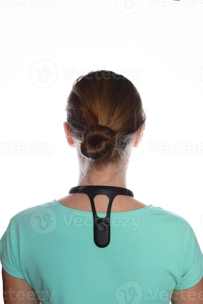 Smart posture corrector on shoulders,  white background photo