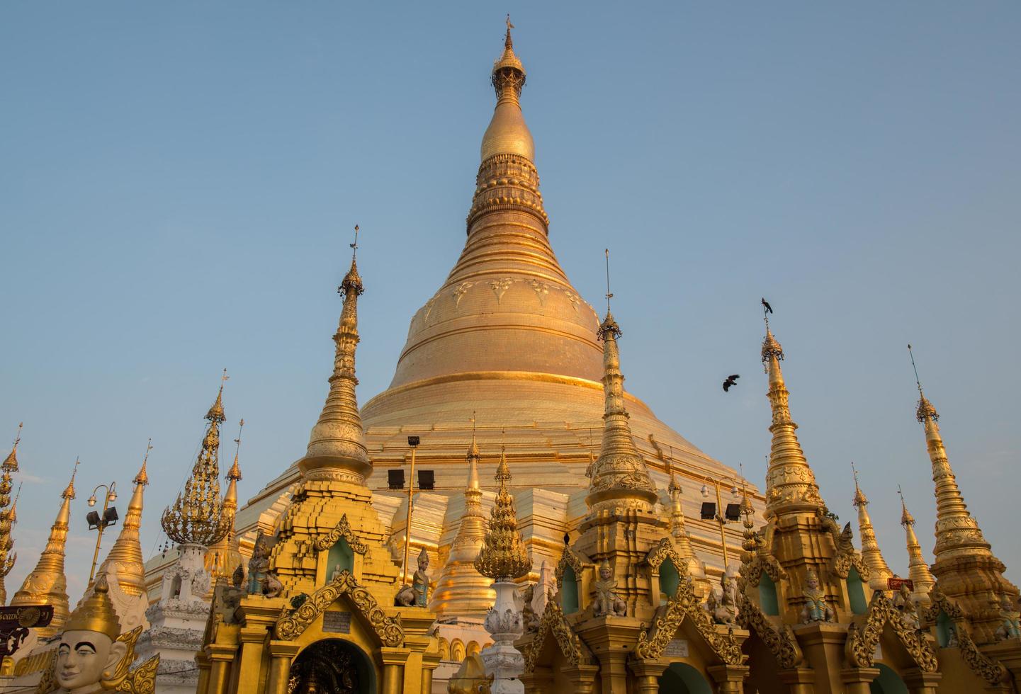 Shwedagon pagoda the most tourist attraction place in Yangon township of Myanmar during the sunset. photo