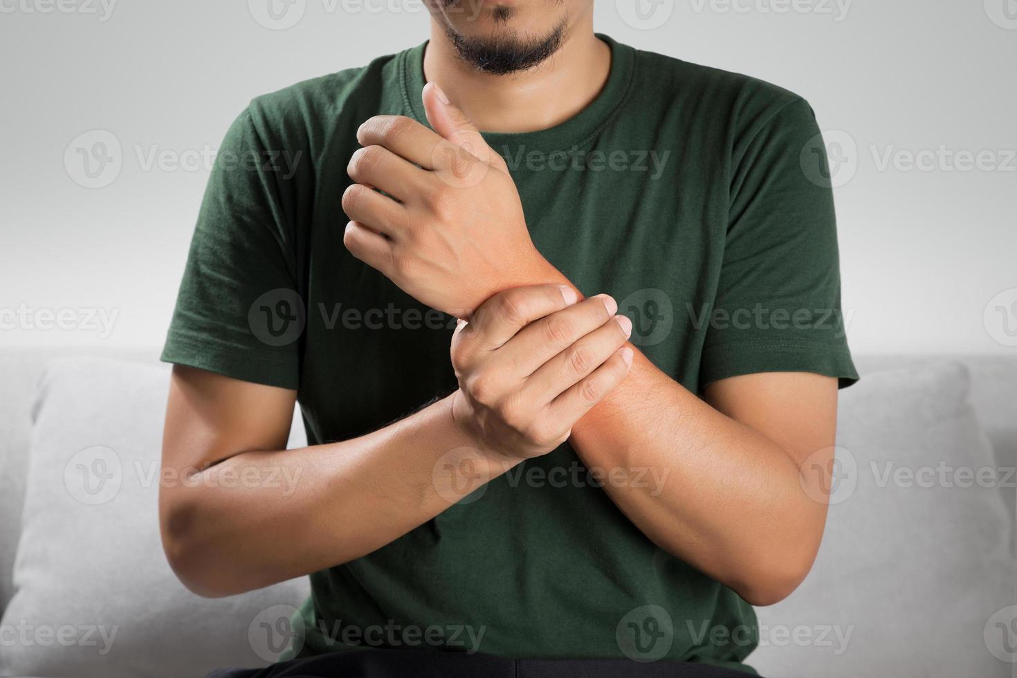 A man sprained wrist symptoms and arthritis in the wrist photo