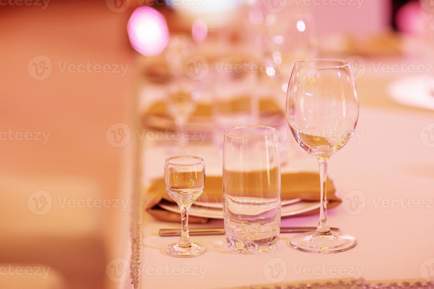 Serving on the table. Crystal glasses. Wedding. Banquet. photo