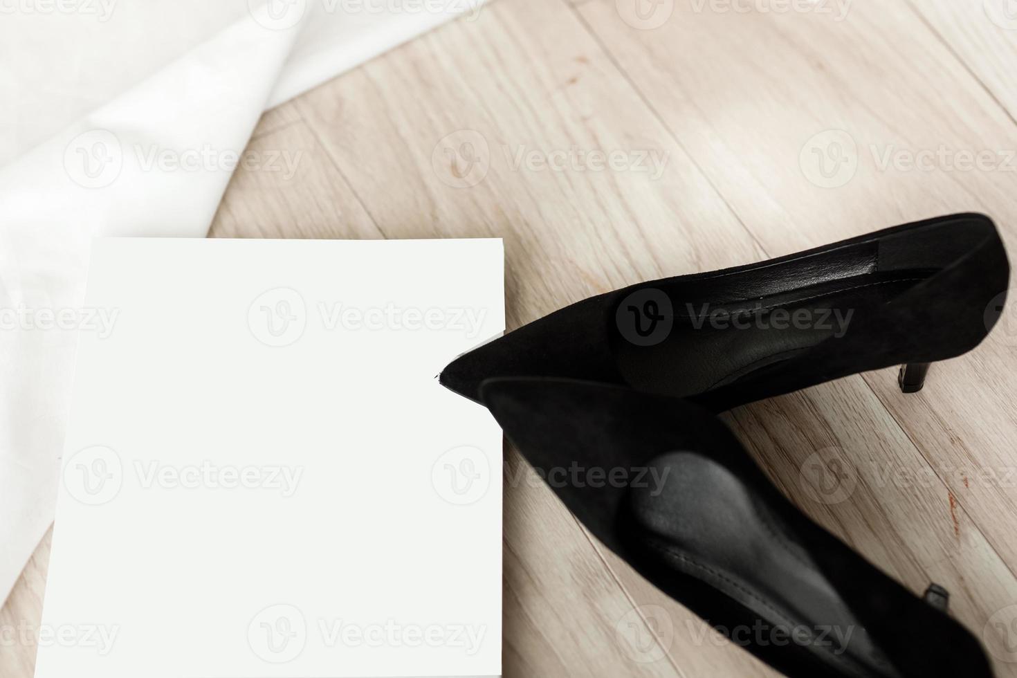 business woman accessories. black high heels and magazine with mock up photo
