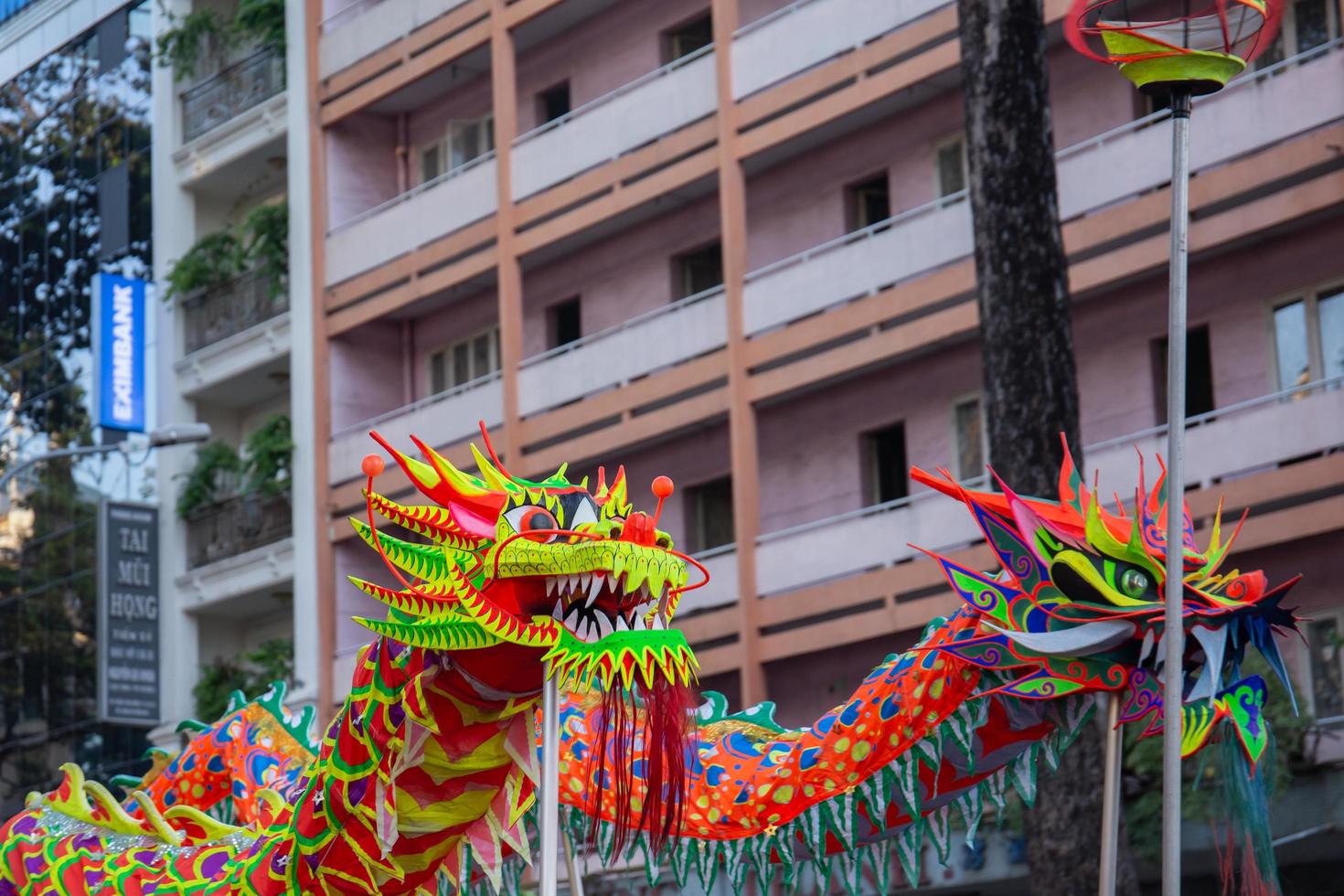 Ho Chi Minh city, Vietnam - 6 Feb 2023 Lunar New Year celebration - The dragon dance, beautiful colorful festive figure. Tet holiday background. Chinese Lunar New Year's Day, Spring Festival. photo