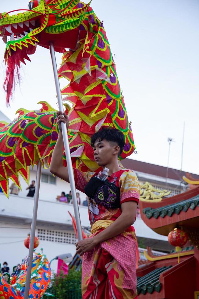 Ho Chi Minh city, Vietnam - 6 Feb 2023 Lunar New Year celebration - The dragon dance, beautiful colorful festive figure. Tet holiday background. Chinese Lunar New Year's Day, Spring Festival. photo
