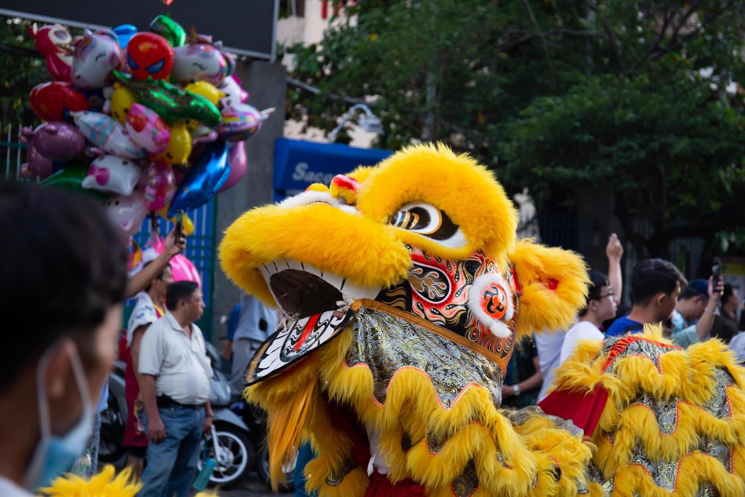 Ho Chi Minh city, Vietnam - 6 Feb 2023 Lunar New Year celebration - The dragon dance, beautiful colorful festive figure. Tet holiday background. Chinese Lunar New Year's Day, Spring Festival. photo