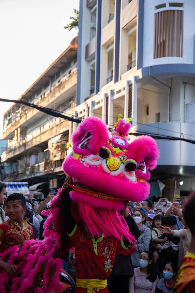 Ho Chi Minh city, Vietnam - 6 Feb 2023 Lunar New Year celebration - The dragon dance, beautiful colorful festive figure. Tet holiday background. Chinese Lunar New Year's Day, Spring Festival. photo