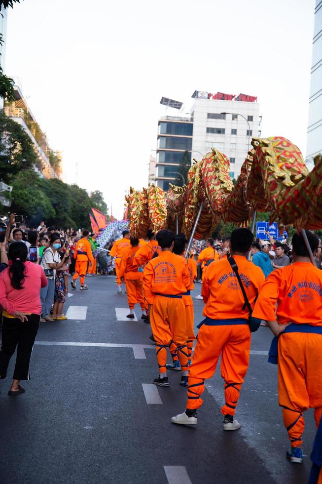 Ho Chi Minh city, Vietnam - 6 Feb 2023 Lunar New Year celebration - The dragon dance, beautiful colorful festive figure. Tet holiday background. Chinese Lunar New Year's Day, Spring Festival. photo