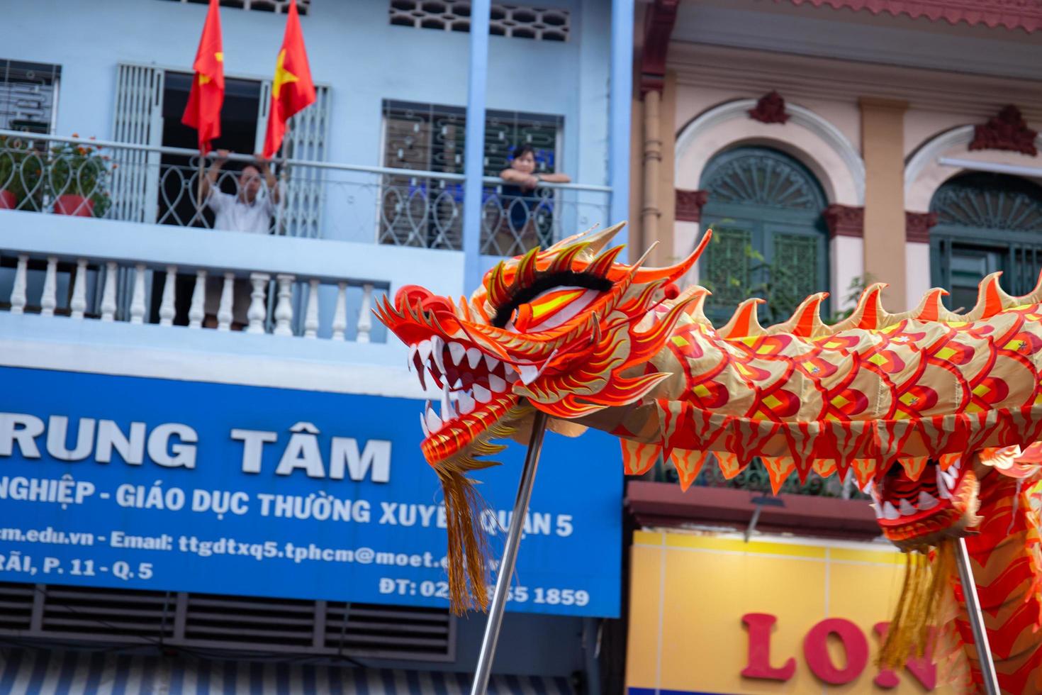 Ho Chi Minh city, Vietnam - 6 Feb 2023 Lunar New Year celebration - The dragon dance, beautiful colorful festive figure. Tet holiday background. Chinese Lunar New Year's Day, Spring Festival. photo