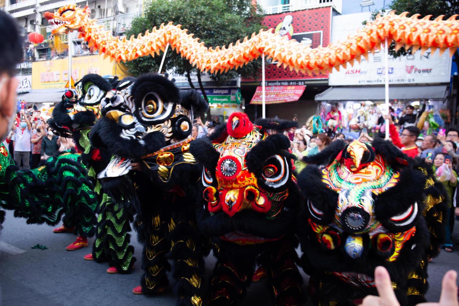 Ho Chi Minh city, Vietnam - 6 Feb 2023 Lunar New Year celebration - The dragon dance, beautiful colorful festive figure. Tet holiday background. Chinese Lunar New Year's Day, Spring Festival. photo