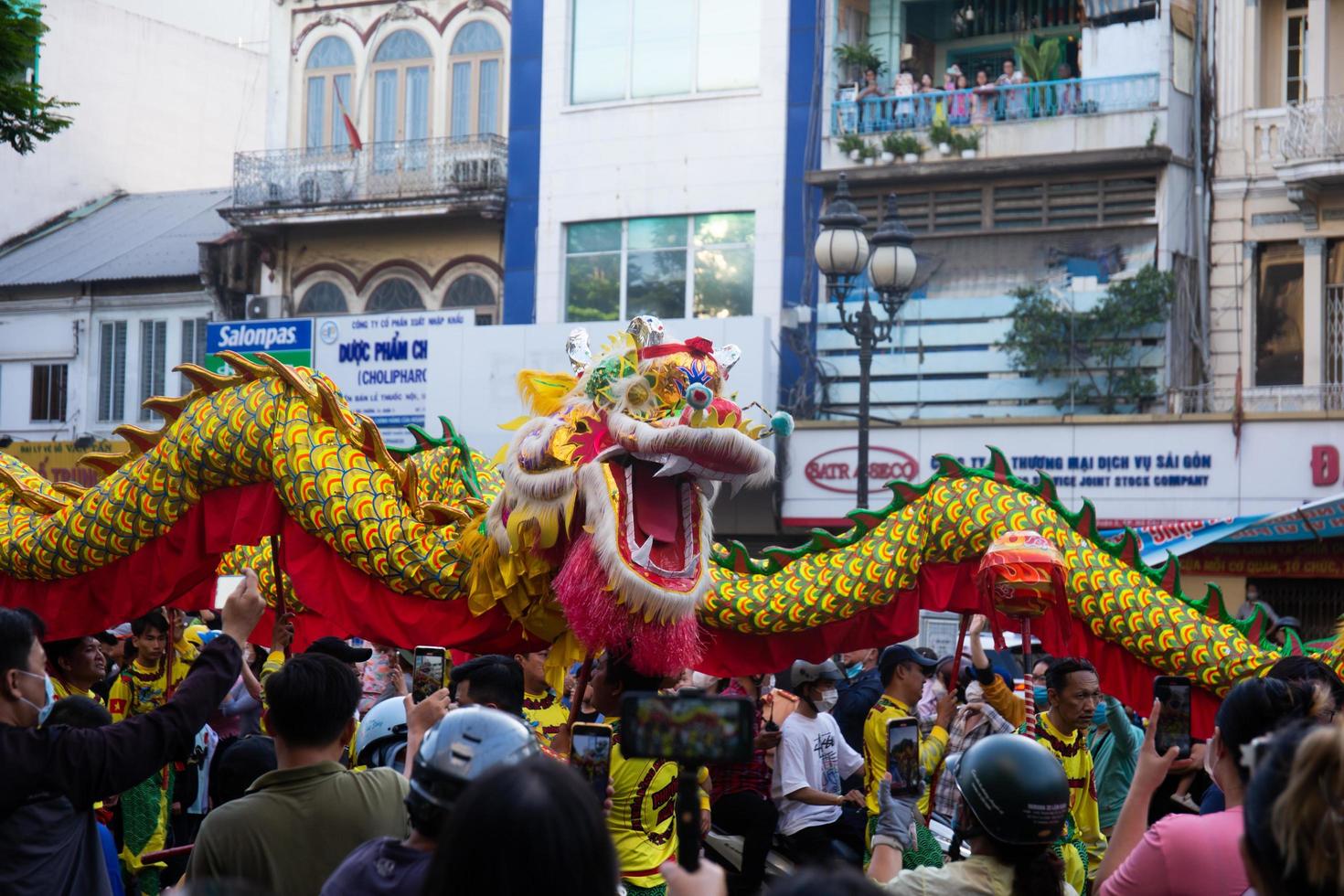 Ho Chi Minh city, Vietnam - 6 Feb 2023 Lunar New Year celebration - The dragon dance, beautiful colorful festive figure. Tet holiday background. Chinese Lunar New Year's Day, Spring Festival. photo