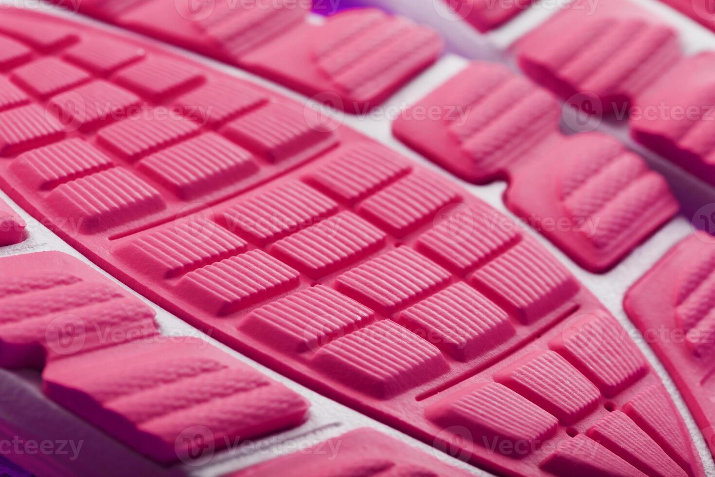 The textured sole design of the pink Macro sneaker. 20029670 Stock