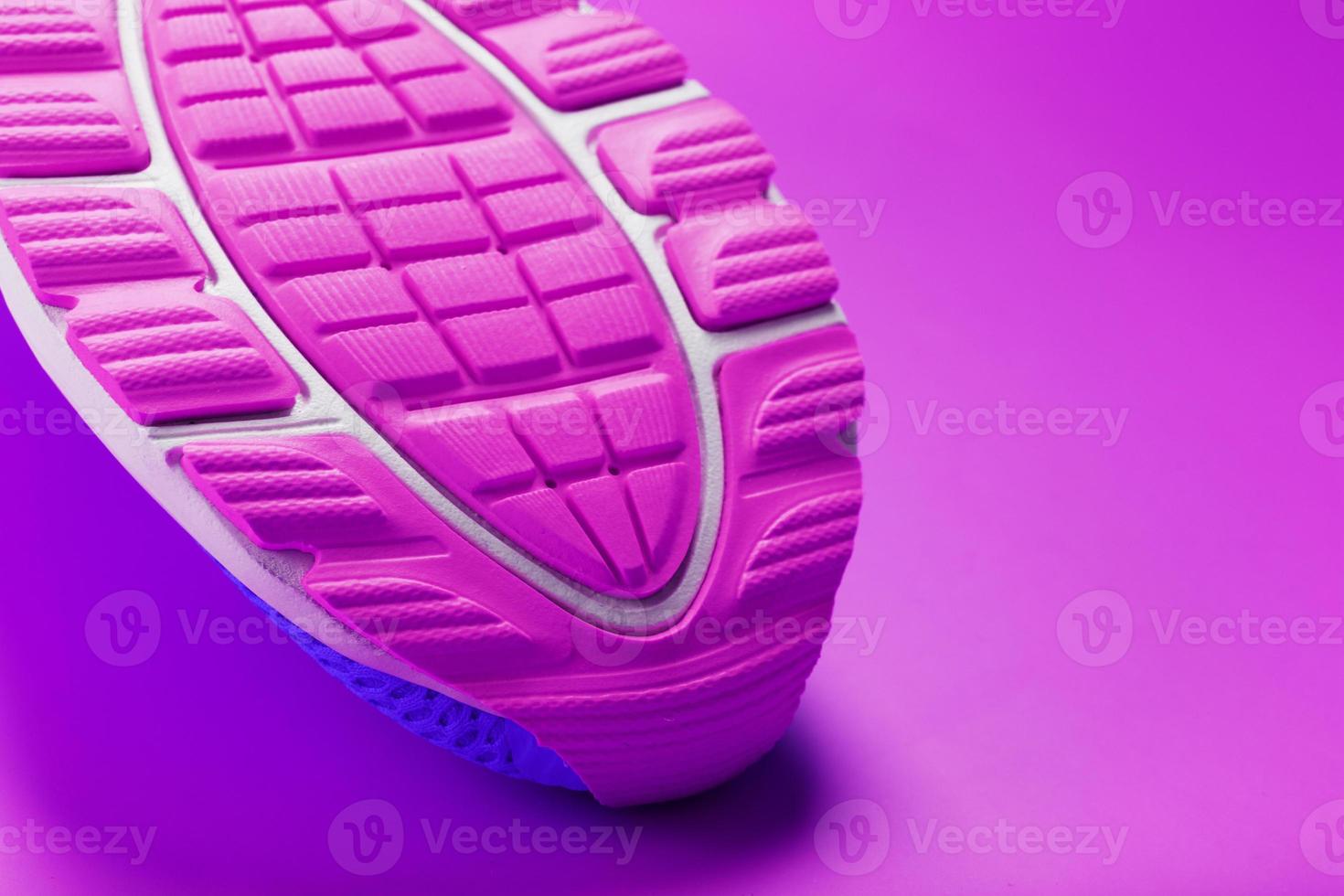 Violet sole of a sports sneaker close-up. photo