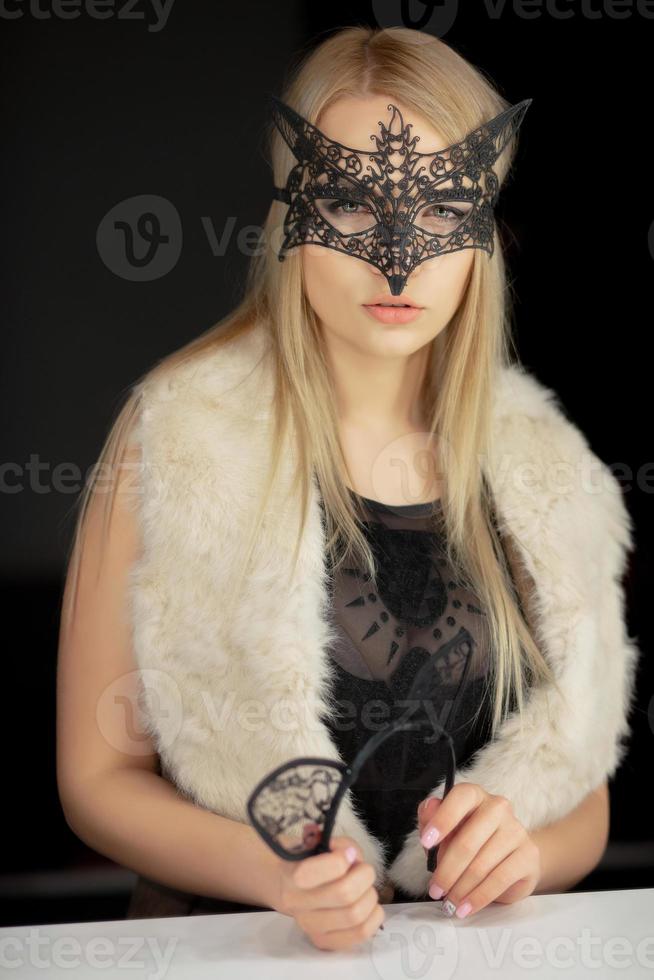 Nice young woman in a mask photo