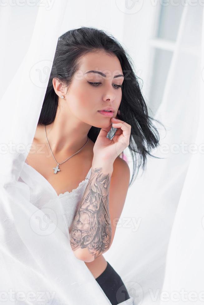 Young brunette posing in studio photo