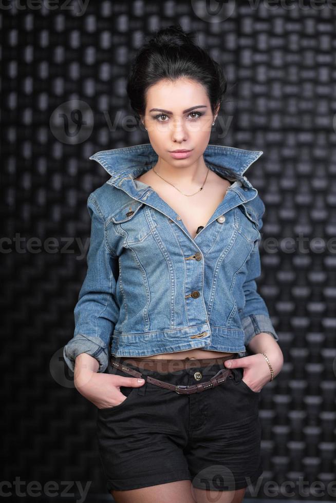 Pretty brunette posing in the studio photo