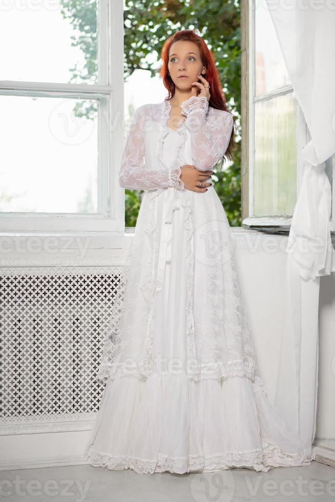 Cute young woman posing in a studio photo