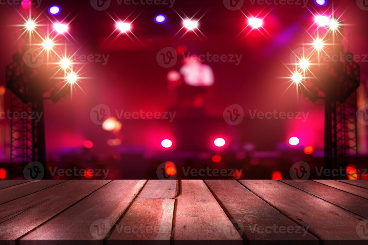 top wood desk with light bokeh in concert blur background,wooden table photo