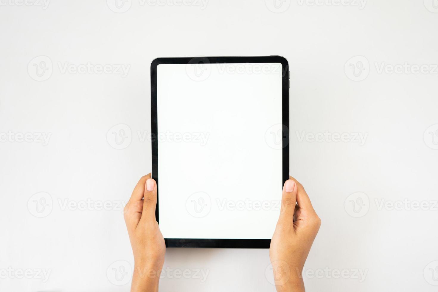 Hand holding blank digital tablet screen photo