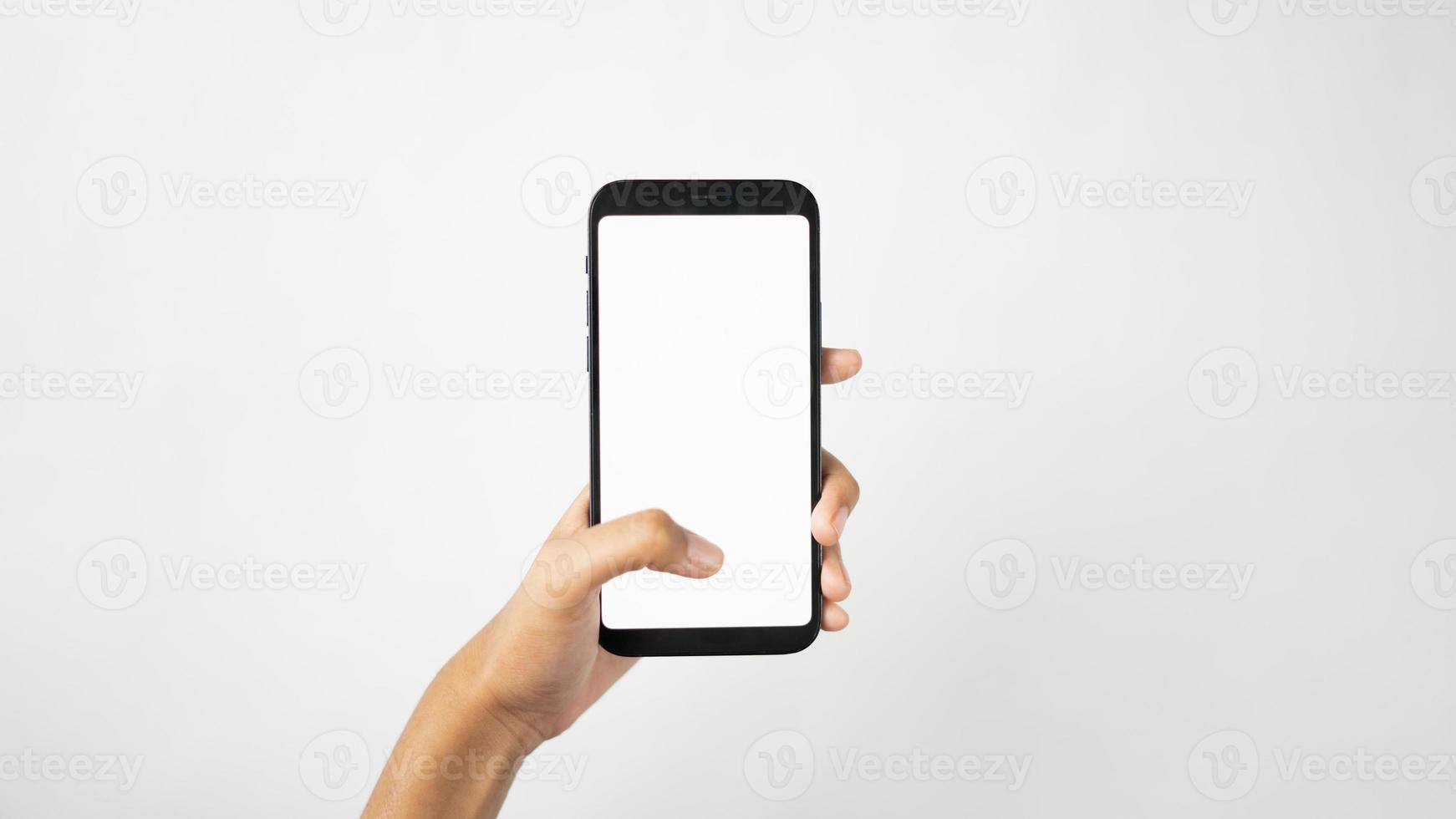 One hand holding blank smartphone isolated for mockup photo