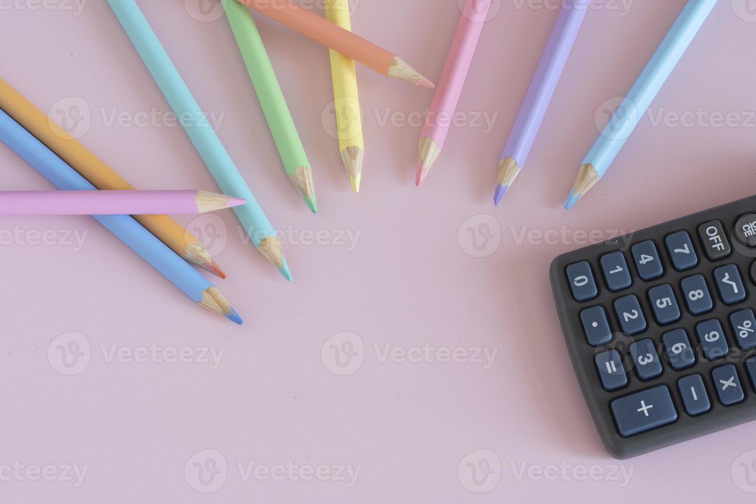 Pastel colored pencils, top view on pink background, illustration concept, education and back to school photo