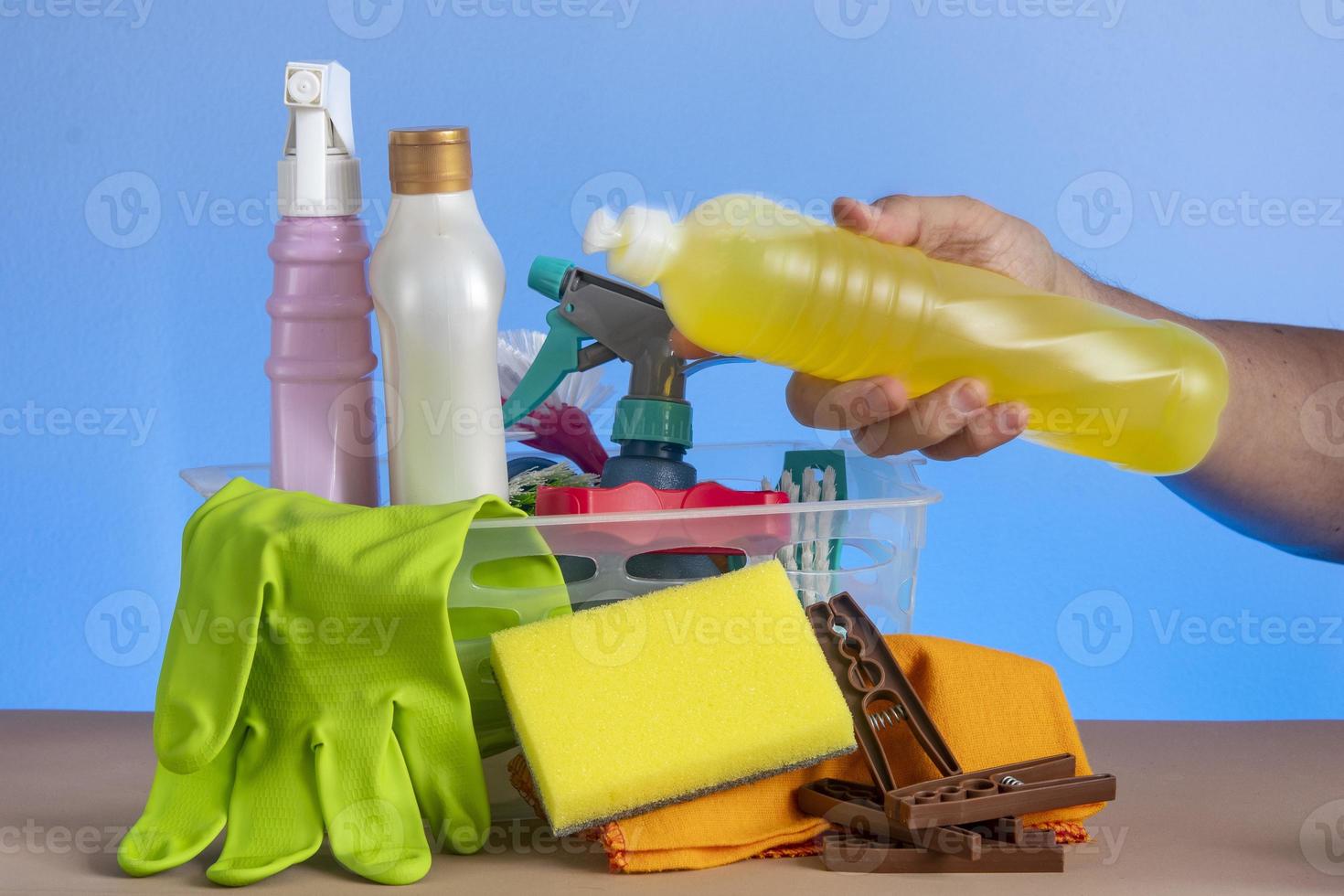 basket with cleaning products for home hygiene use photo