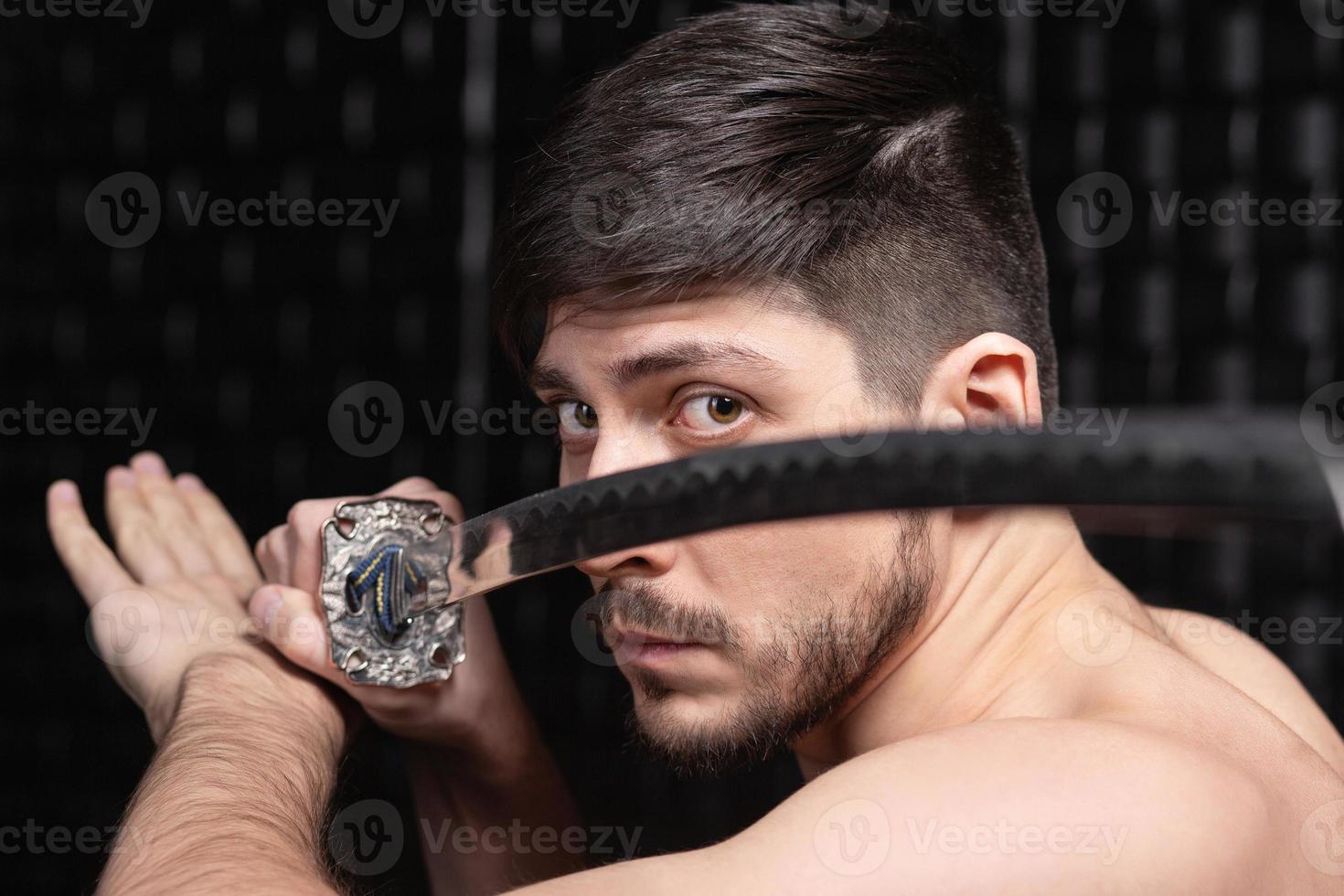 Portrait of handsome man posing in studio photo