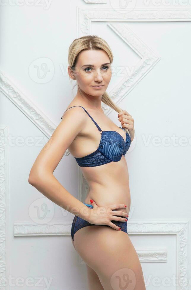 A young blonde woman wearing underwear … – Buy image – 12441687 ❘