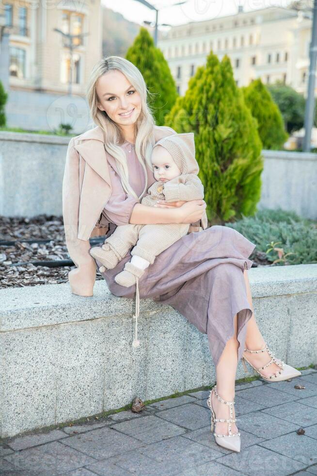 Happy beautiful mother with a small daughter photo