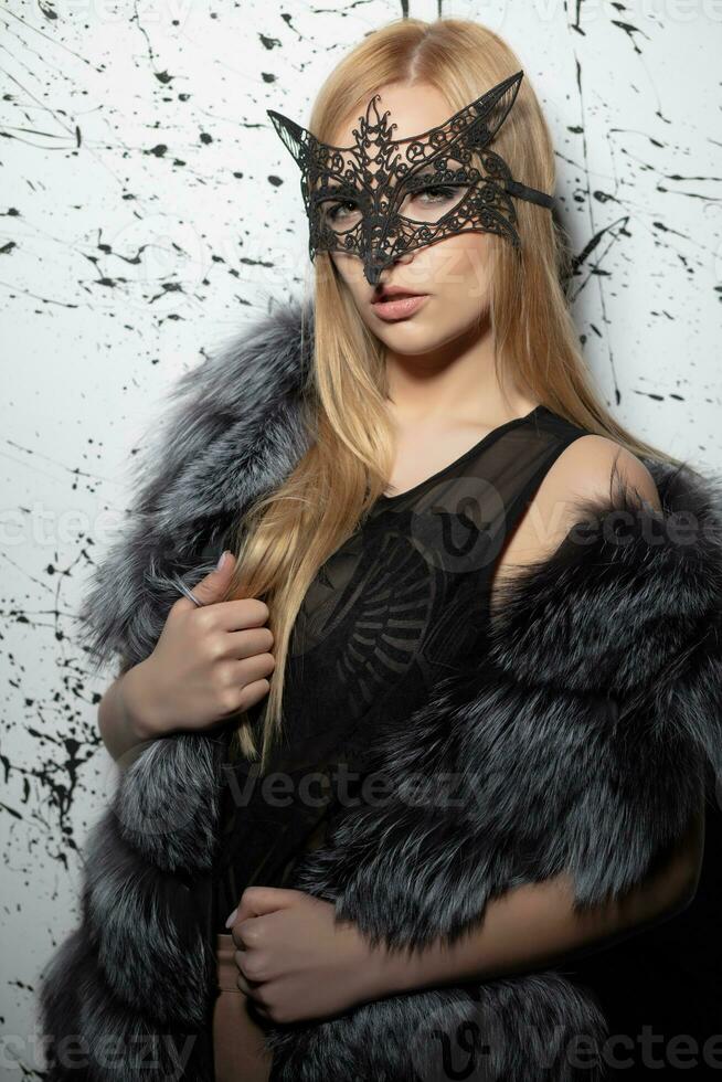 Portrait of a cute woman in a mask photo