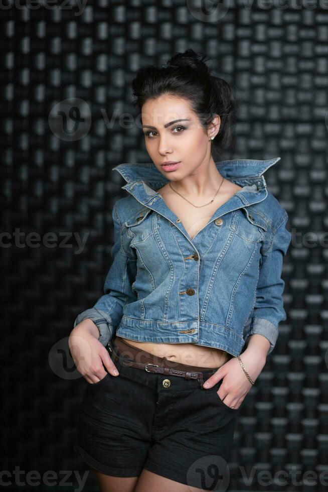 Cute brunette posing in the studio photo