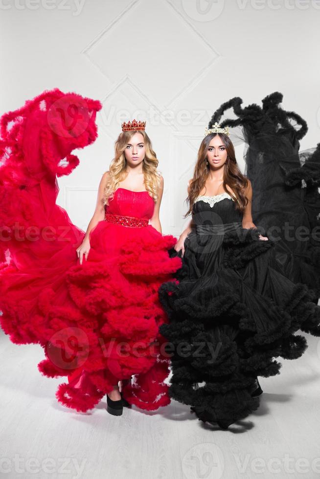 Two cute women pose in studio photo