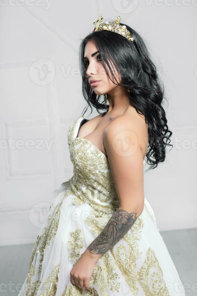 Young lovely woman posing in a studio photo