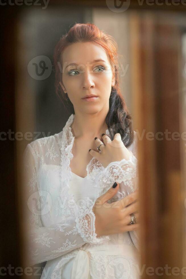 Portrait of a young elegance redhaired photo