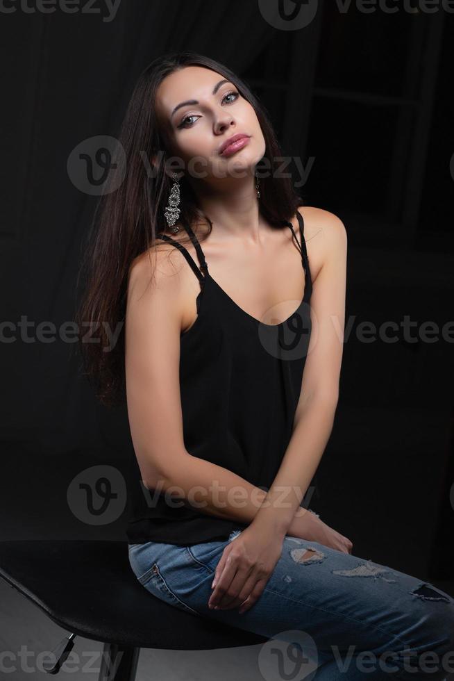 Young beautiful brunette posing in studio photo