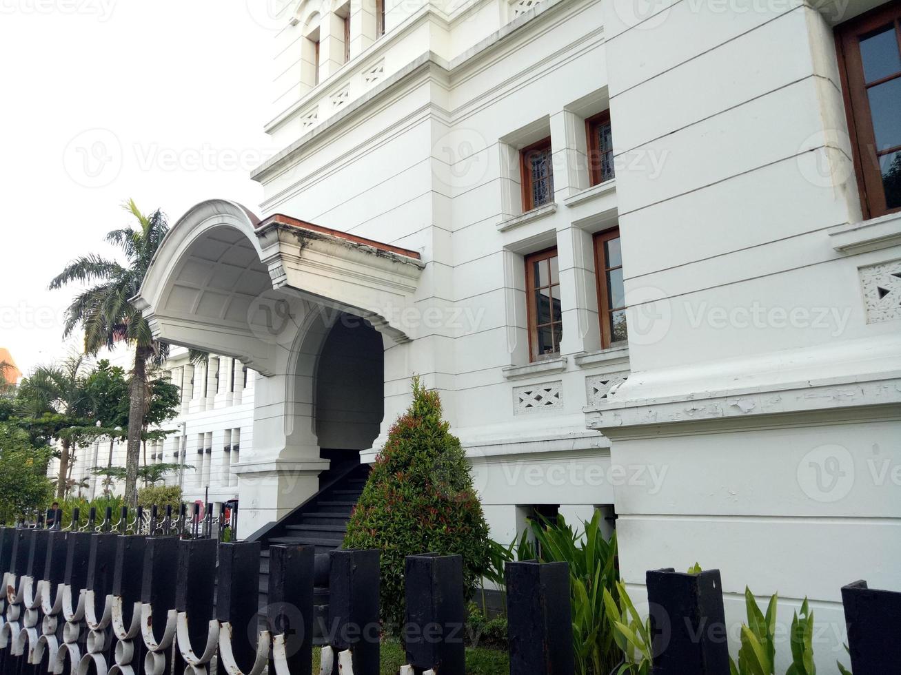 antique white house with flowers photo