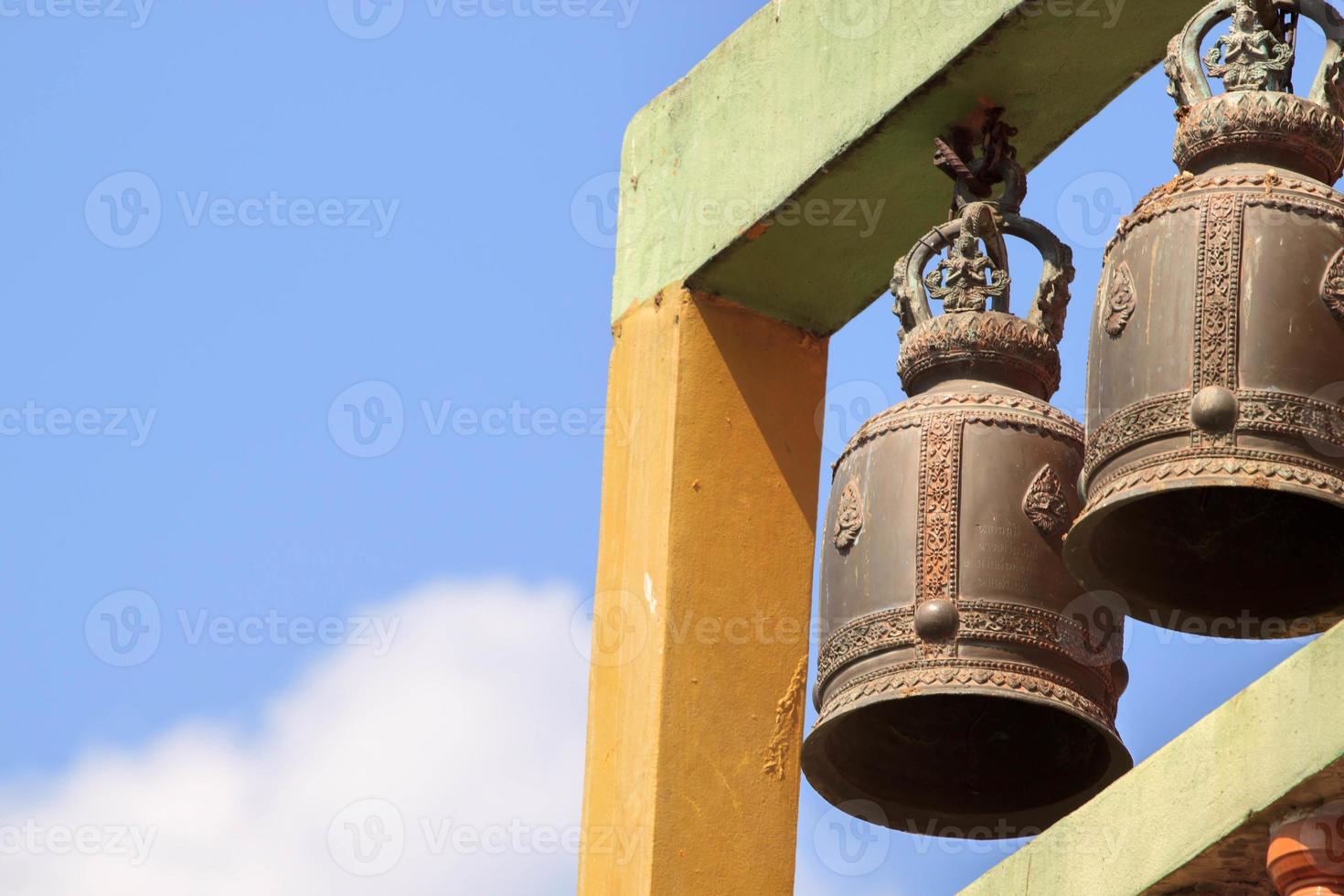 Bells built on high mountains made of brass and the sound of bells ringing throughout the Thai temple hills in rural Thailand. photo