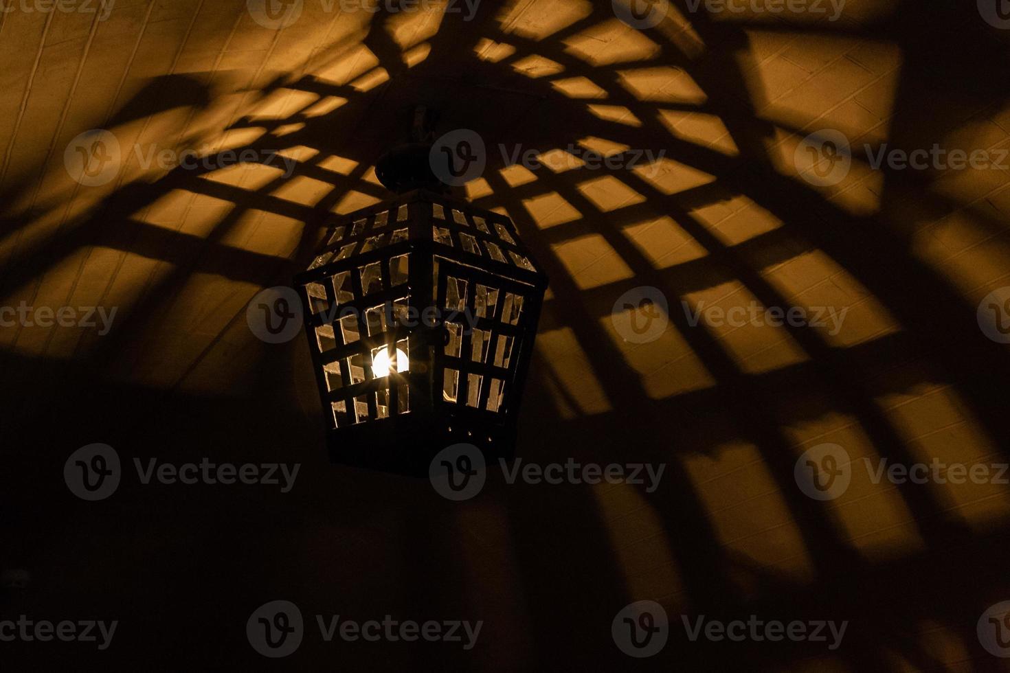 Antique lamps chandeliers in the cave dungeon photo