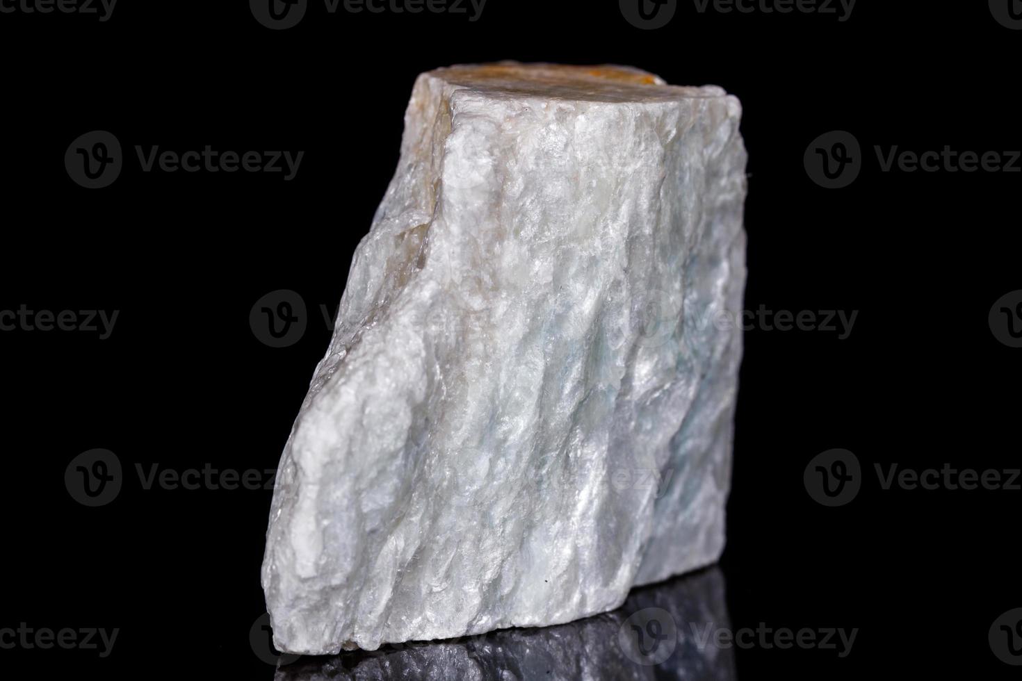 Macro mineral stone Talc on black background photo
