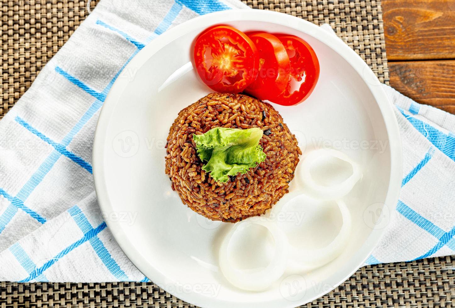 jollof rice with mean - vegetable and fruits photo