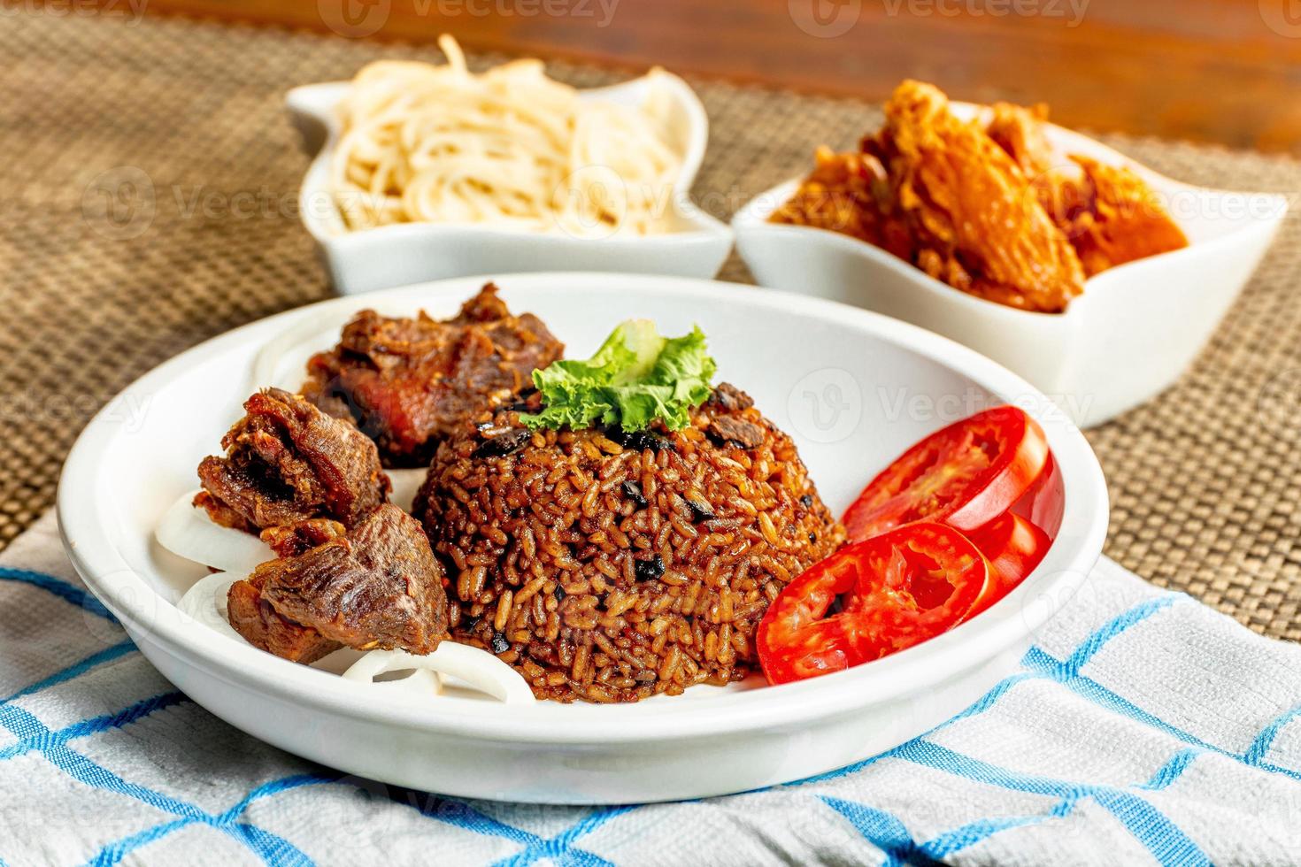 jollof rice with mean - vegetable and fruits photo