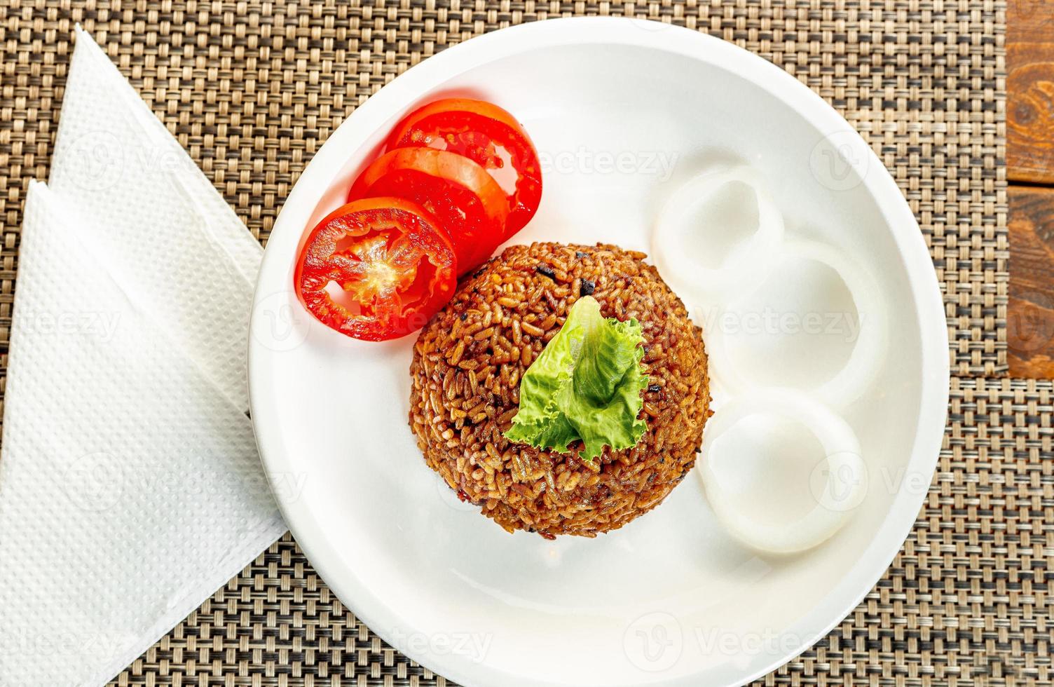 jollof rice with mean - vegetable and fruits photo