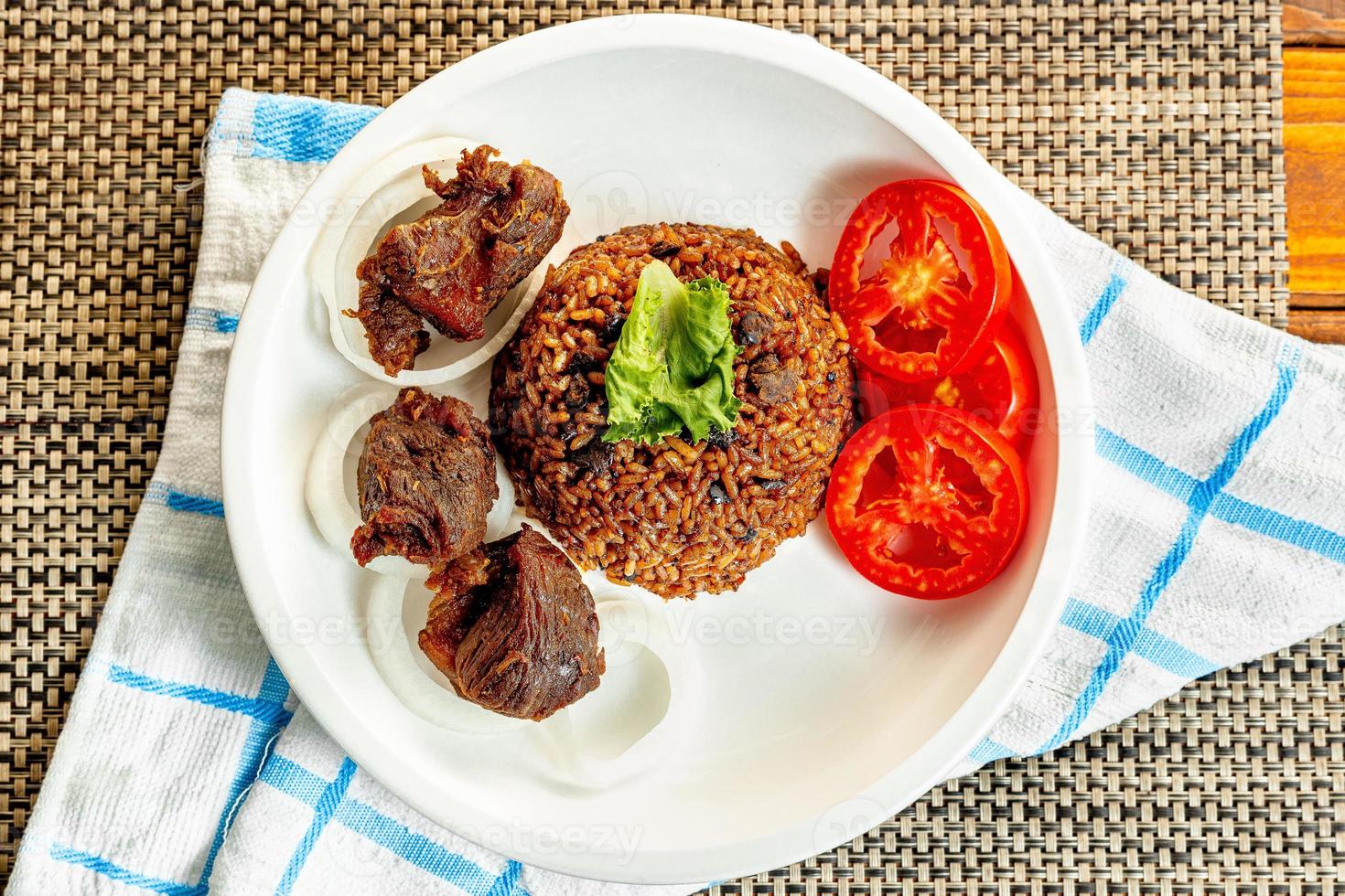 jollof rice with mean - vegetable and fruits photo