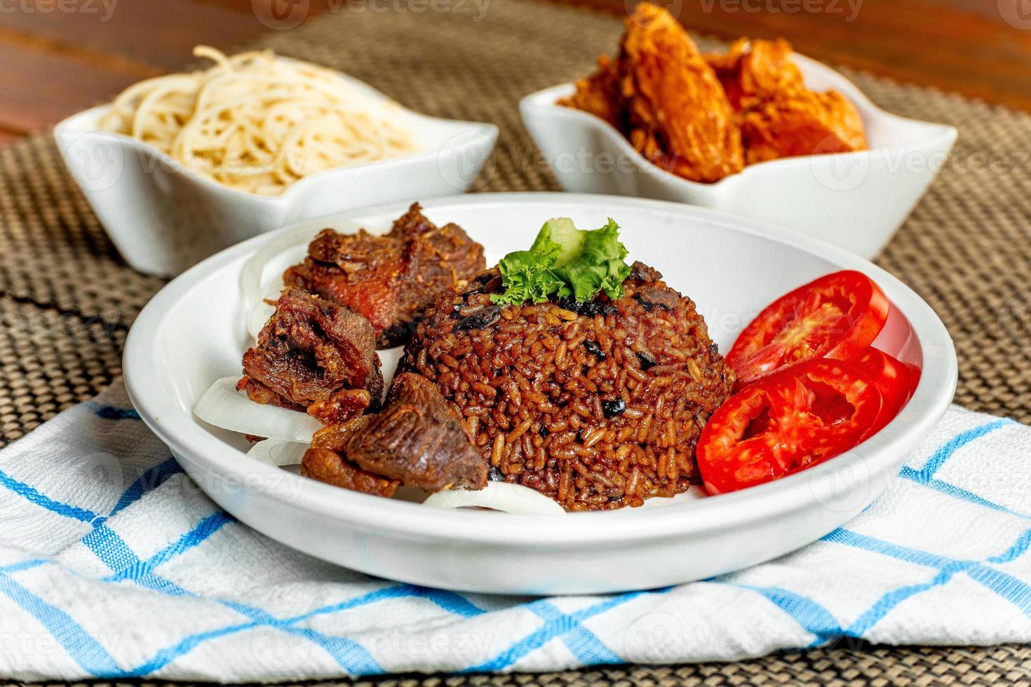 jollof rice with mean - vegetable and fruits photo