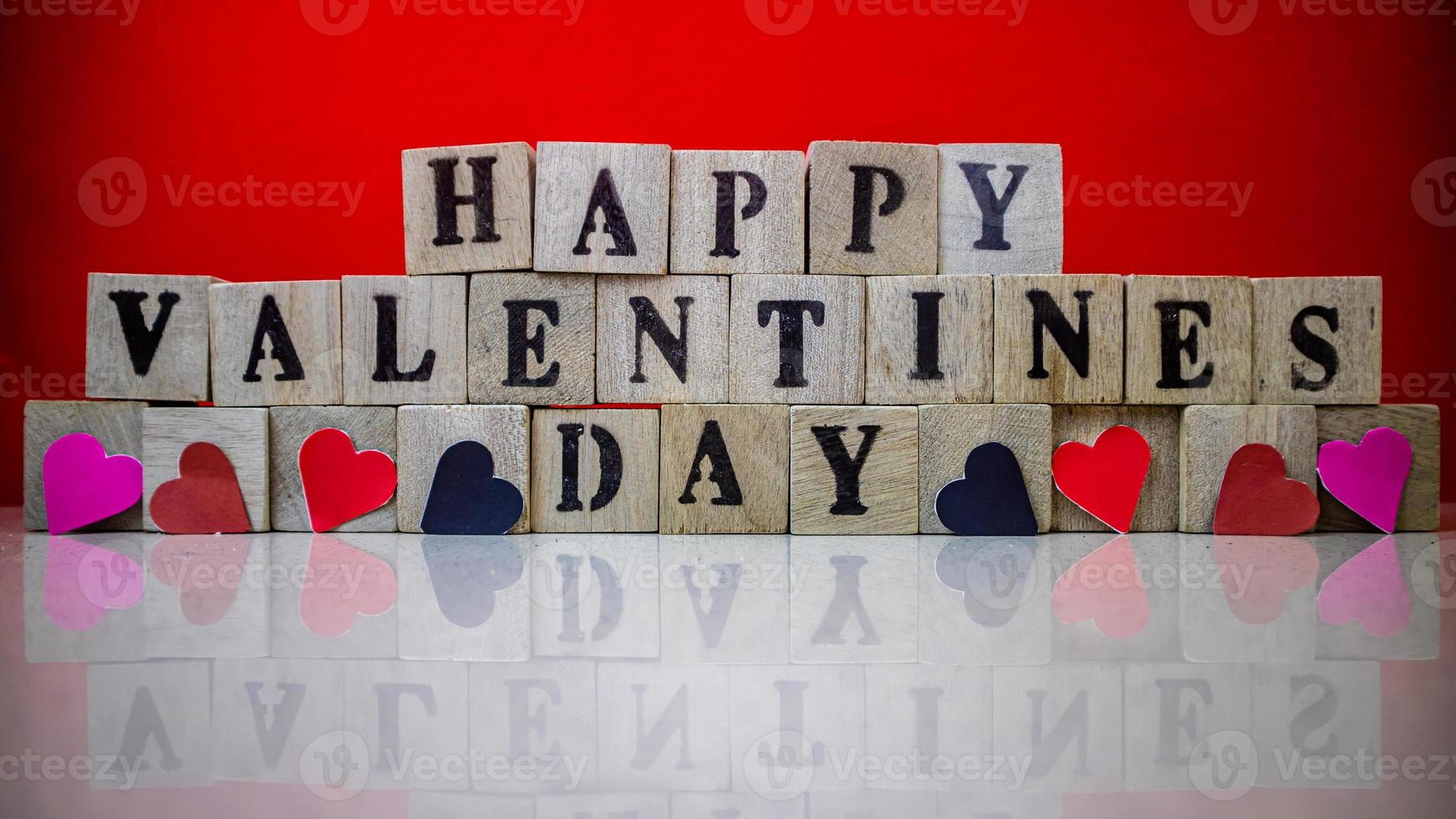 Happy valentine day on wooden blocks photo