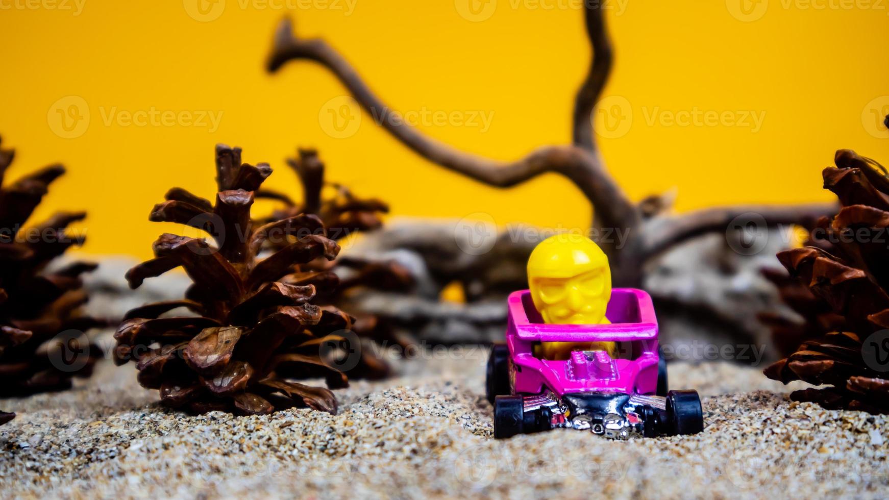 Minahasa, Indonesia  saturday, December 2022, a toy car among the pinecones photo