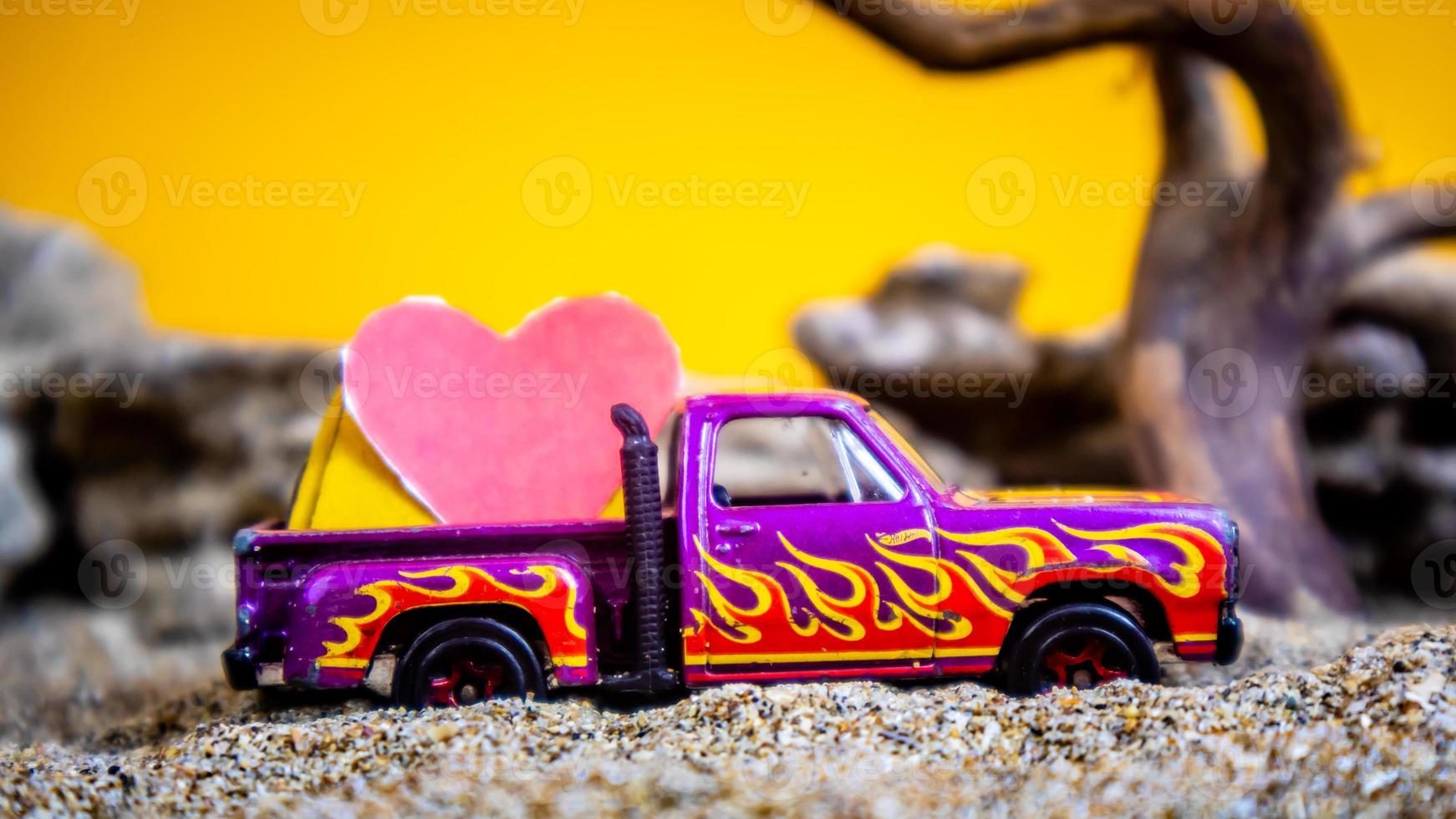 Minahasa, Indonesia  December 2022, the toy cars transporting hearts photo