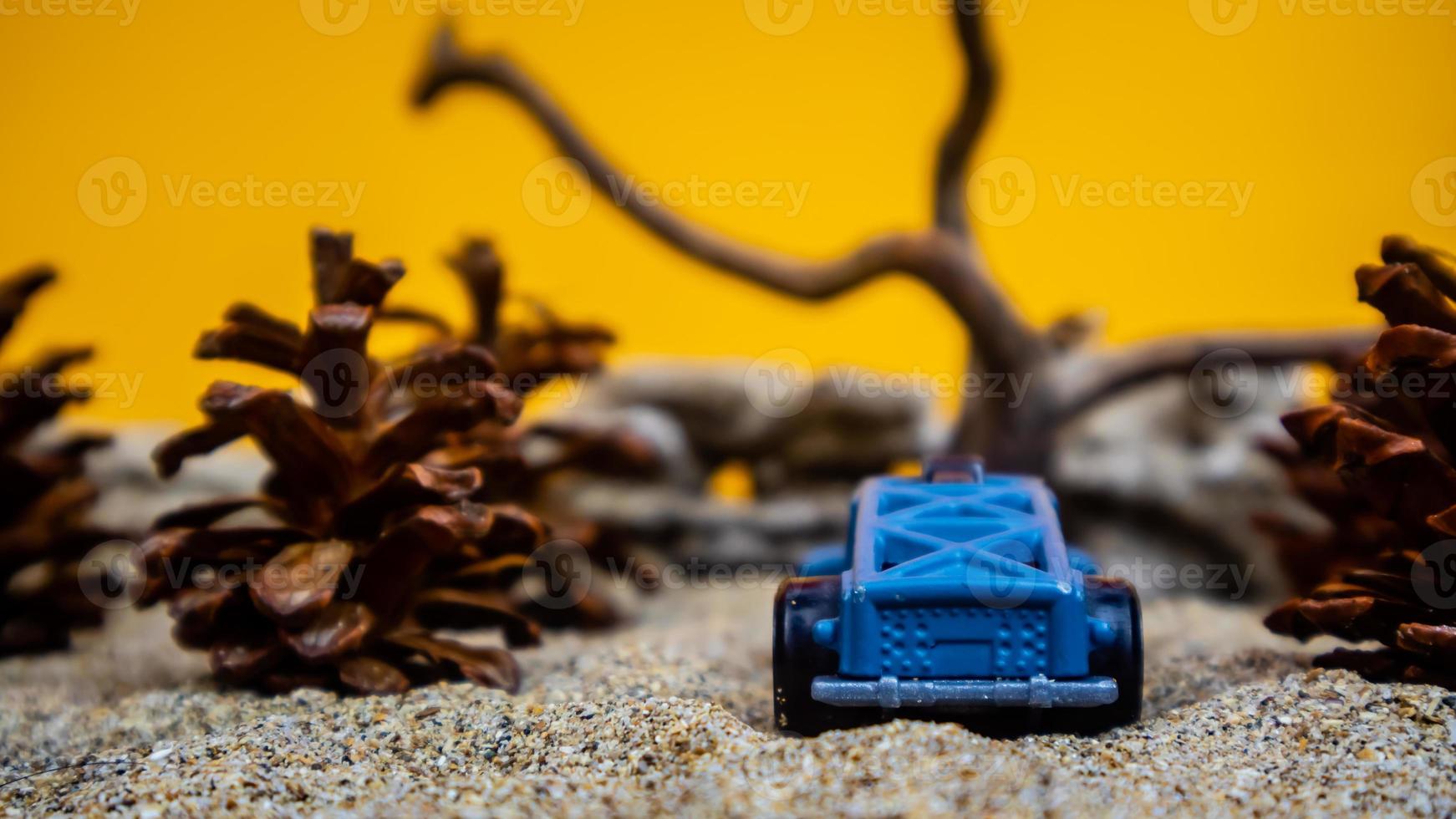 Minahasa, Indonesia  saturday, December 2022, a toy car among the pinecones photo
